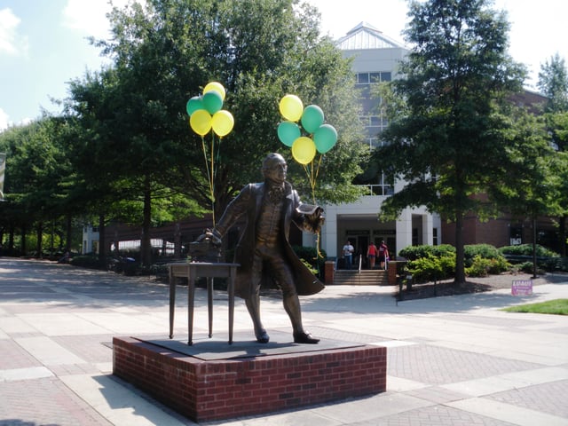 Statue of George Mason on the Fairfax campus, adorned with balloons