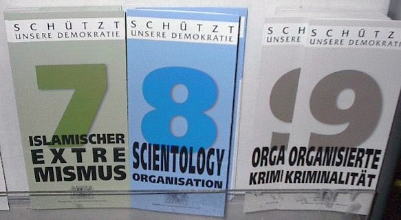 Official German information leaflets from the Bavarian Office for the Protection of the Constitution on (from left to right) Islamic extremism, Scientology, and organized crime. "Several states published pamphlets about Scientology (and other religious groups) that detailed the Church's ideology and practices. States defended the practice by noting their responsibility to respond to citizens' requests for information about Scientology as well as other subjects. While many of the pamphlets were factual and relatively unbiased, some warned of alleged dangers posed by Scientology to the political order, to the free market economic system, and to the mental and financial well being of individuals. Beyond the Government's actions, the Catholic Church and the Evangelical Lutheran Church have been public opponents of Scientology. Evangelical 'Commissioners for Religious and Ideological Issues' have been particularly active in this regard."