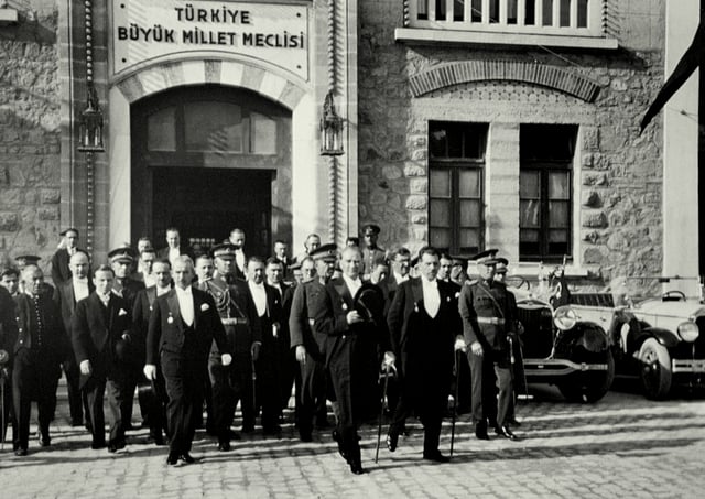 President Mustafa Kemal Atatürk (center) and Prime Minister İsmet İnönü (left) leaving the Grand National Assembly of Turkey during the 7th anniversary celebrations of the Turkish Republic in 1930.