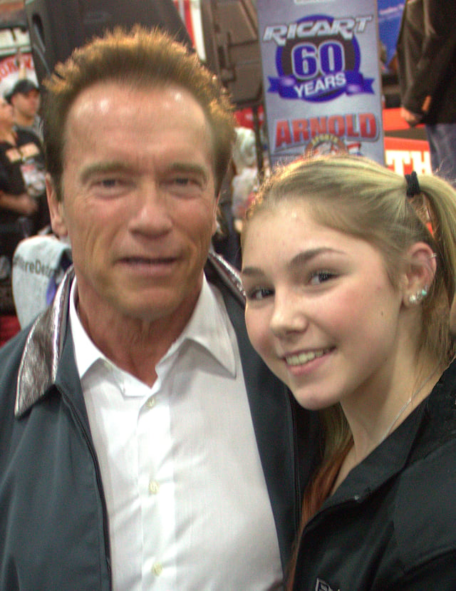 Schwarzenegger with Russian powerlifter Maryana Naumova at the Arnold Sports Festival, 2013