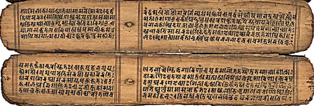 11th-century Nepalese Sanskrit text Devi Mahatmya palm leaf page. Bhujimol script, which is now extinct. It is related to Devanagari, Kutila and Newari scripts.
