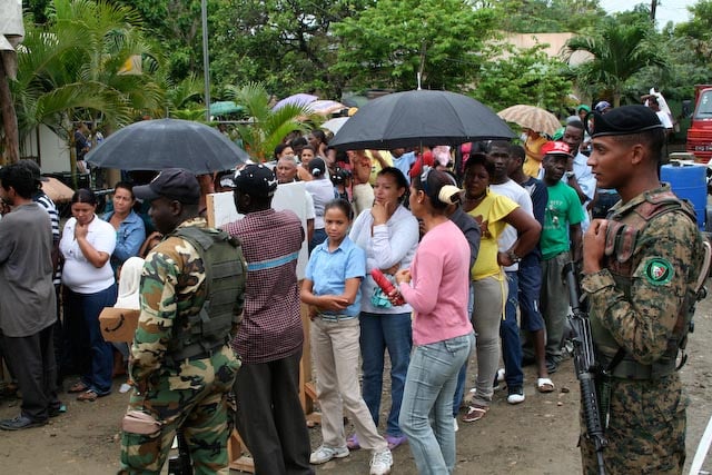 Dominicans and Haitians lined up to attend medical providers from the U.S. Army Reserve