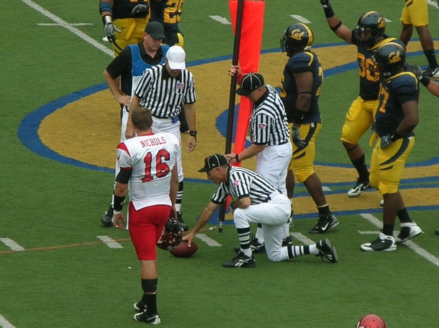 Officials use the chains to measure for a first down.