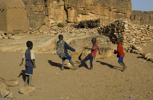 Malian children playing football in a Dogon village