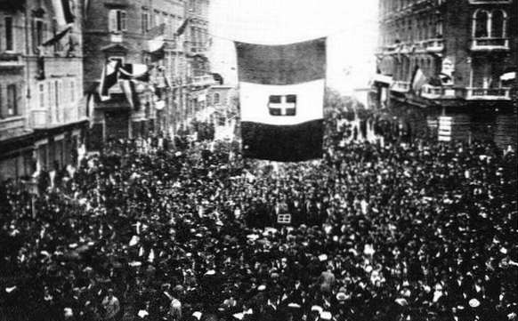 Residents of Fiume cheer the arrival of Gabriele d'Annunzio and his blackshirt-wearing nationalist raiders, as D'Annunzio and Fascist Alceste De Ambris developed the quasi-fascist Italian Regency of Carnaro (a city-state in Fiume) from 1919 to 1920 and whose actions by D'Annunzio in Fiume inspired the Italian Fascist movement