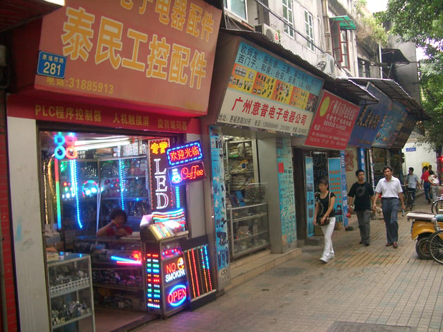 Shops in one of the streets of Guangzhou specialize in selling various electronic components, supplying the needs of local consumer electronics manufacturers. The shop in front is in the LED business.