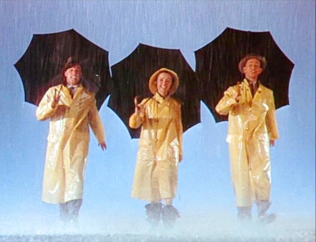 Gene Kelly, Reynolds, and Donald O'Connor during the Singin' in the Rain trailer (1952)