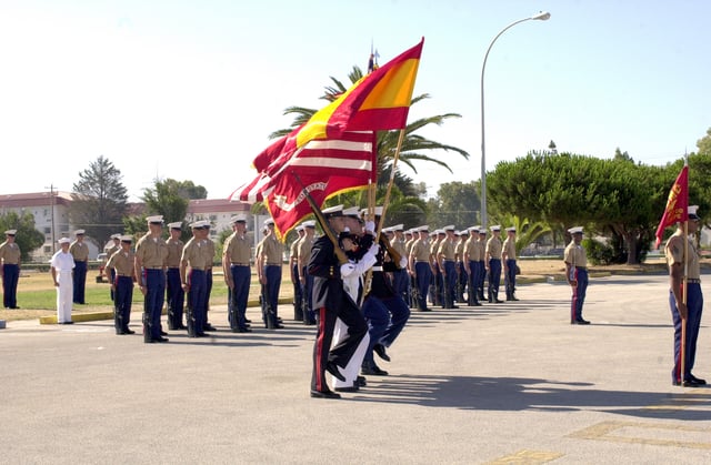 The joint U.S.-Spanish Color Guard aboard Naval Station, Rota, parades the colors during the Change of Command and Marine Corps Security Force Europe.