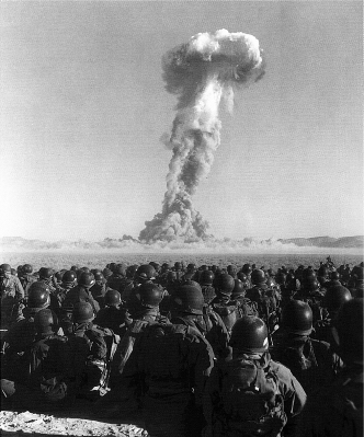U.S. Army soldiers look on an atomic bomb test of Operation Buster-Jangle at the Nevada Test Site during the Korean War.