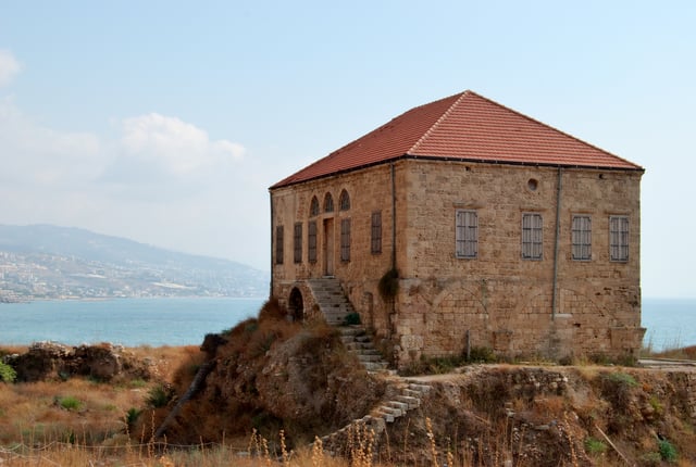 Traditional Lebanese house overlooking the Mediterranean sea, Byblos. This house is within the antiquities complex and illustrates the modern ground level with respect to excavations