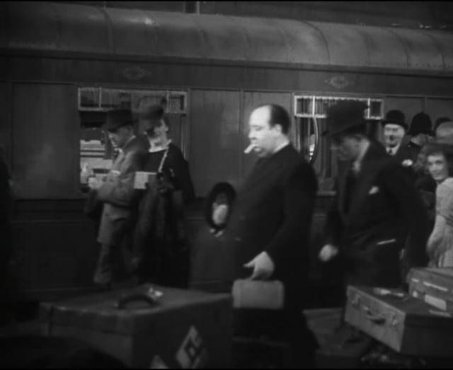 Hitchcock's cameo appearance in The Lady Vanishes (1938)