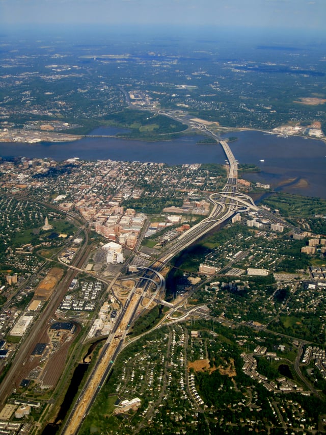 The southern portion of the Capital Beltway along the Potomac River, featuring portions of Washington, D.C., Maryland, and Virginia.  Old Town Alexandria, Joint Base Anacostia-Bolling, and National Harbor, Maryland are visible.