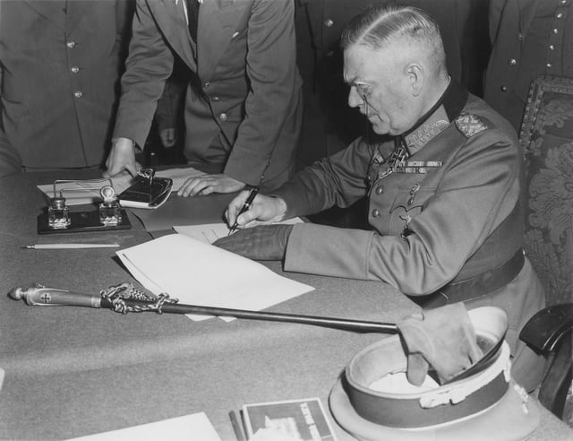 Field Marshal Wilhelm Keitel signing the final surrender terms on 8 May 1945 in Berlin