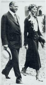 Earhart walking with President Hoover in the grounds of the White House on January 2, 1932