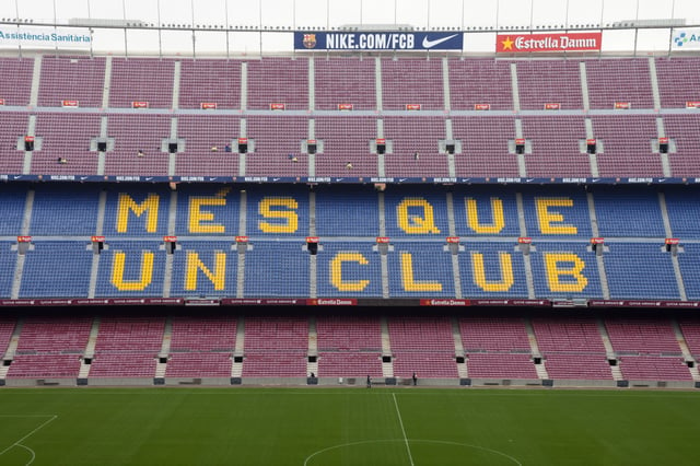 One of the Camp Nou stands displays Barcelona's motto, "Més que un club", meaning 'More than a club'.