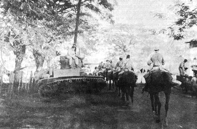 26th Cavalry (Philippine Scouts) move into Pozorrubio past an M3 Stuart tank