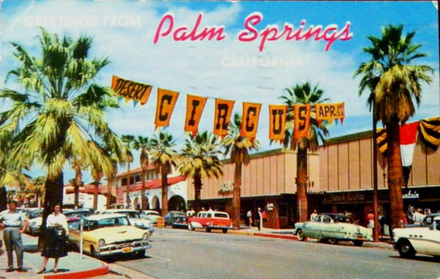 A postcard of Palm Canyon Dr. through Palm Springs' downtown village in the 1950s