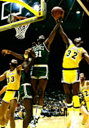 Johnson (right) battles Boston's Cedric Maxwell in 1985 NBA Finals