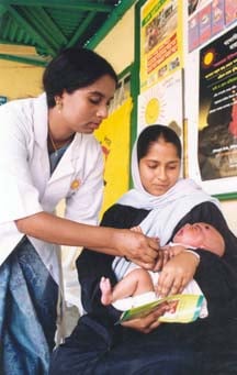 An infant being immunized in Bangladesh
