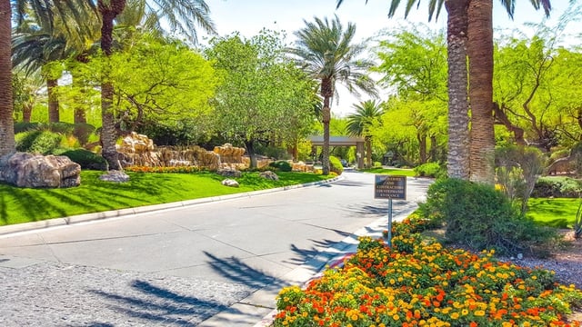 Affluent neighborhoods are located throughout the Las Vegas Valley. Above is the entrance to MacDonald Highlands.
