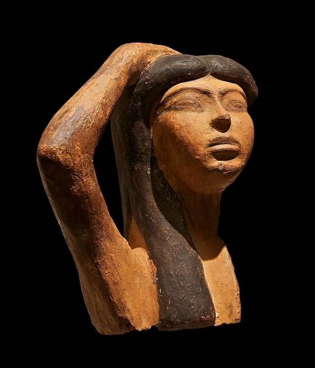 Sculpture of a woman, possibly Isis, in a pose of mourning; 15th or 14th century BCE