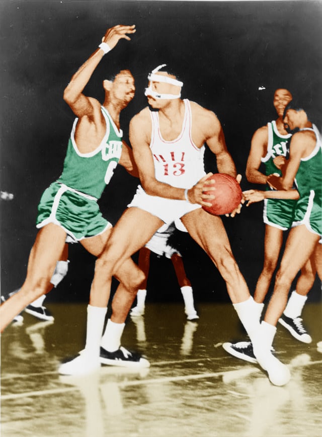 Wilt Chamberlain of the Philadelphia 76ers being defended by Celtics' center Bill Russell