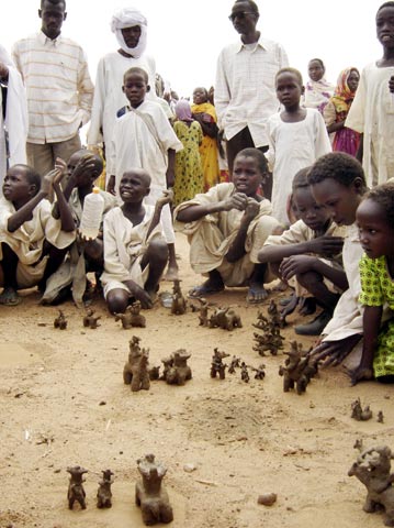 Children in the camps are encouraged to confront their psychological scars. The clay figures depict an attack by Janjaweed.