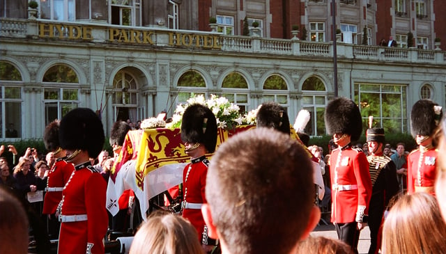 Diana's coffin, draped in the royal standard with an ermine border, borne through the streets of London on its way to Westminster Abbey