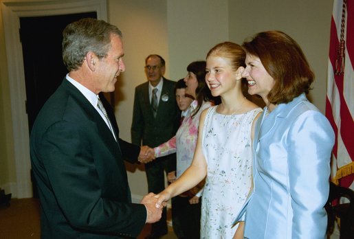 Smart with her mother, Lois, and President George W. Bush at the signing of the PROTECT Act of 2003