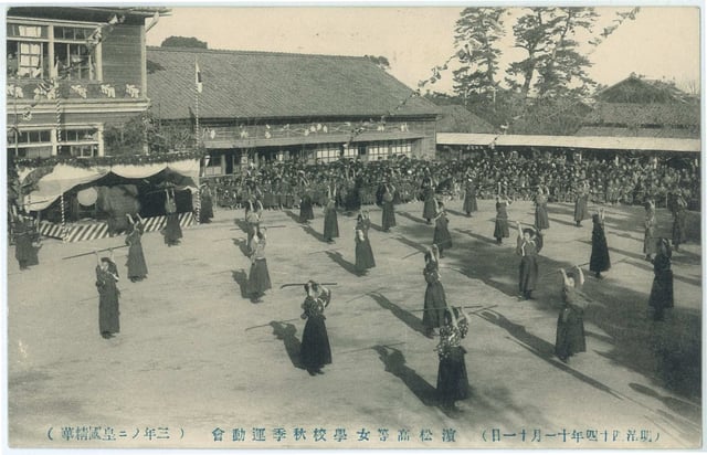 Demonstrating the use of the naginata at a sports festival in Hamamatsu in 1911. Discipline training in school clubs historically has influenced the senpai–kōhai system with students.