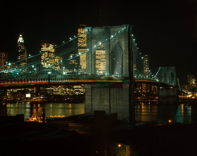 The Brooklyn Bridge, the first of multiple crossings constructed across the East River, connects Long Island with Manhattan Island (background).