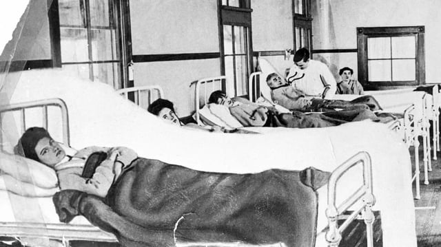 Mary Mallon ("Typhoid Mary") in a hospital bed (foreground): She was forcibly quarantined as a carrier of typhoid fever in 1907 for three years and then again from 1915 until her death in 1938.