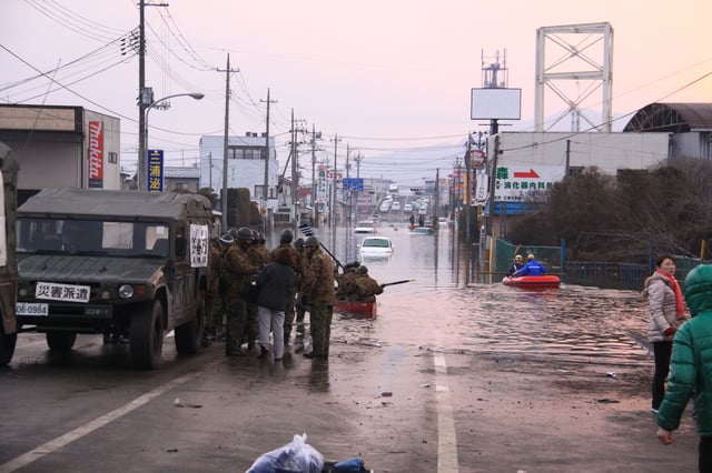Rescue operations in the floodwaters in downtown Ishinomaki