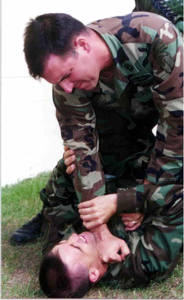 U.S. Army Combatives instructor Matt Larsen demonstrates a chokehold.