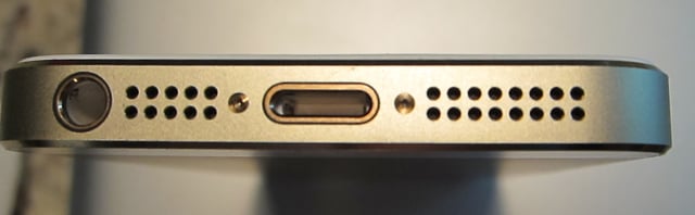 From left to right is the headphone jack, microphone, Lightning connector, and built-in speaker on the base of the iPhone 5S.