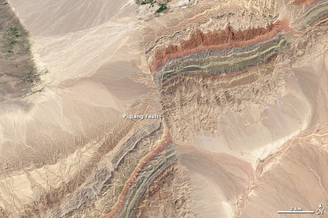 Satellite image of the Piqiang Fault, a northwest trending left-lateral strike-slip fault in the Taklamakan Desert south of the Tien Shan Mountains, China (40.3°N, 77.7°E)