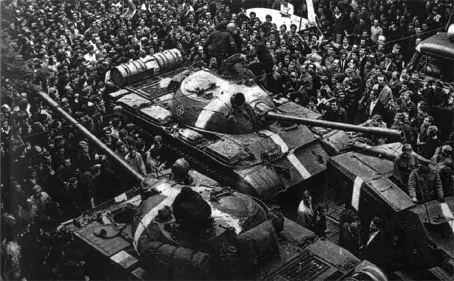 Soviet tanks, marked with white crosses to distinguish them from Czechoslovak tanks, on the streets of Prague during the Warsaw Pact invasion of Czechoslovakia, 1968