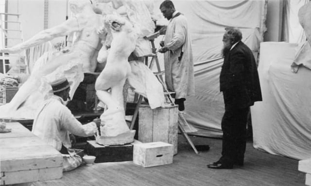Rodin observing work on the monument to Victor Hugo at the studio of his assistant Henri Lebossé in 1896
