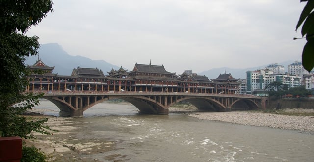A bridge with ancient Chinese architectural features, across Qingyi River, at town centre of Ya'an