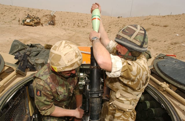 British soldiers engage Iraqi Army positions with their 81mm Mortars south of Basra, 26 March 2003.