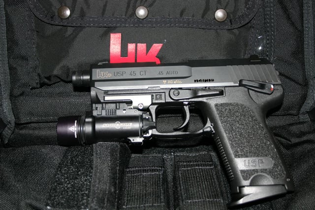 HK USP Compact Tactical .45 ACP equipped with a SureFire flashlight
