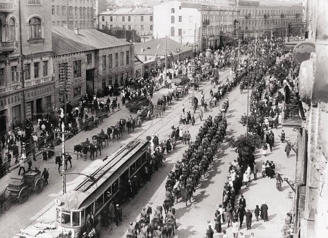 Polish troops enter Kiev in May 1920 during the Polish–Soviet War in which Ukrainians sided with Poland against the Bolsheviks. Following the Peace of Riga signed on 18 March 1921 Poland took control of modern-day western Ukraine and Soviet forces took control of eastern Ukraine.