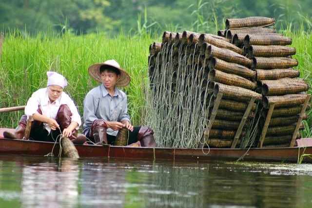 Fishermen with traditional fish traps, Vietnam