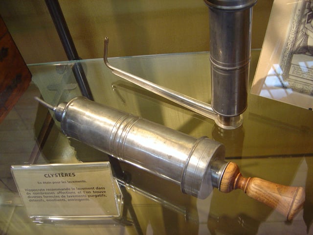A normal clyster syringe (front) and the nozzle for a syringe designed for self-administration * (rear)*. The latter avoided the need for a second party to attend an embarrassing procedure.