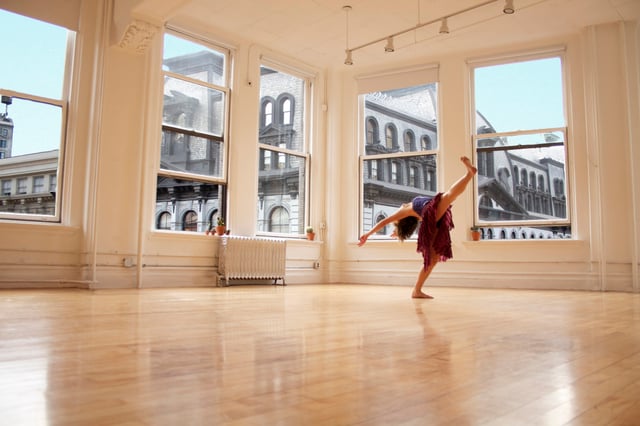 A dancer practices in a dance studio, the primary setting for training in classical dance and many other styles