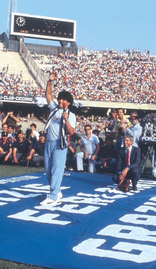 Maradona salutes the crowd at San Paolo Stadium during his presentation in Naples, 5 July 1984