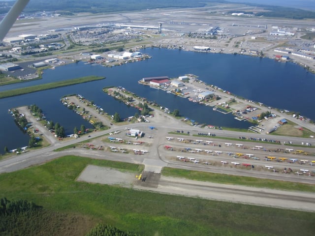 Aerial view of Lake Hood Seaplane Base (foreground) and Ted Stevens Anchorage International Airport (background).