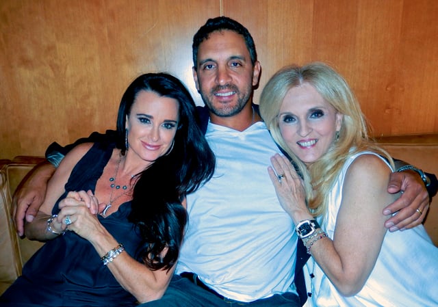 From Left: Daughter-in-law Kyle Richards, son Mauricio Umansky, and Dr. Estella Sneider at Estella's birthday party in 2013.