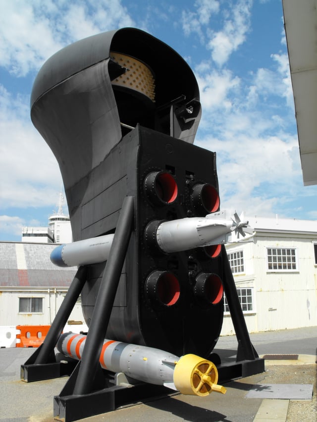 The preserved bow section of HMAS Oxley: The mouths of the six torpedo tubes are displayed, along with the modified sonar dome and a mockup of the bow sonar array.