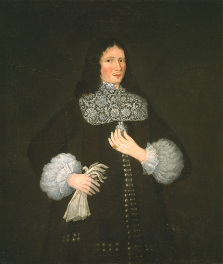 Puritan influence lingered in New England. This merchant of Boston wears his own long hair, not a wig. The flat lace collar with curved corners that came into fashion in the 1660s is worn over a simple dark coat and waistcoat, 1674.